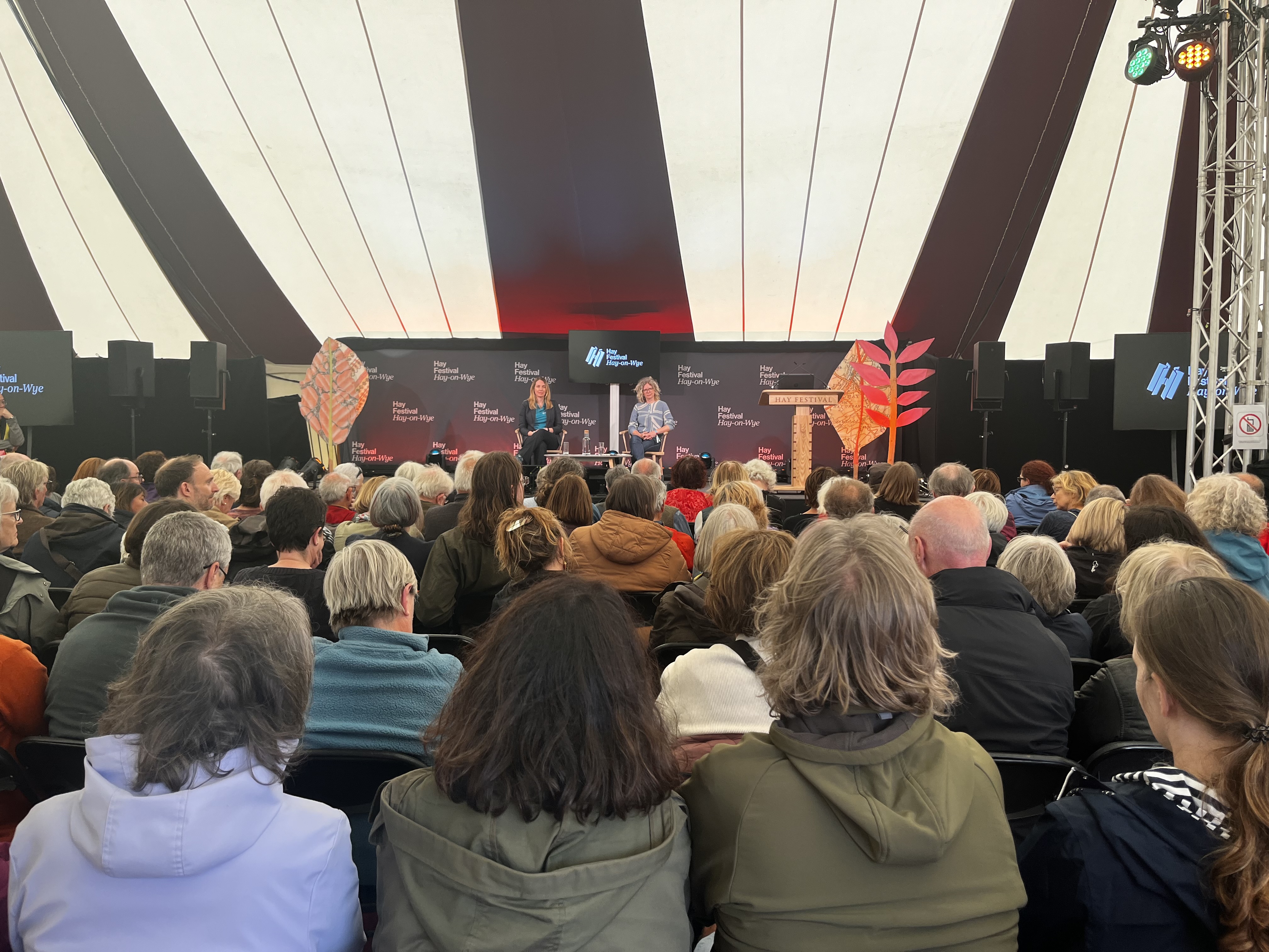 An audience at the Hay Festival listening to Dr Jen Wolowic and Dr Anwen Elias discuss 'Doing Demcracy Differently'