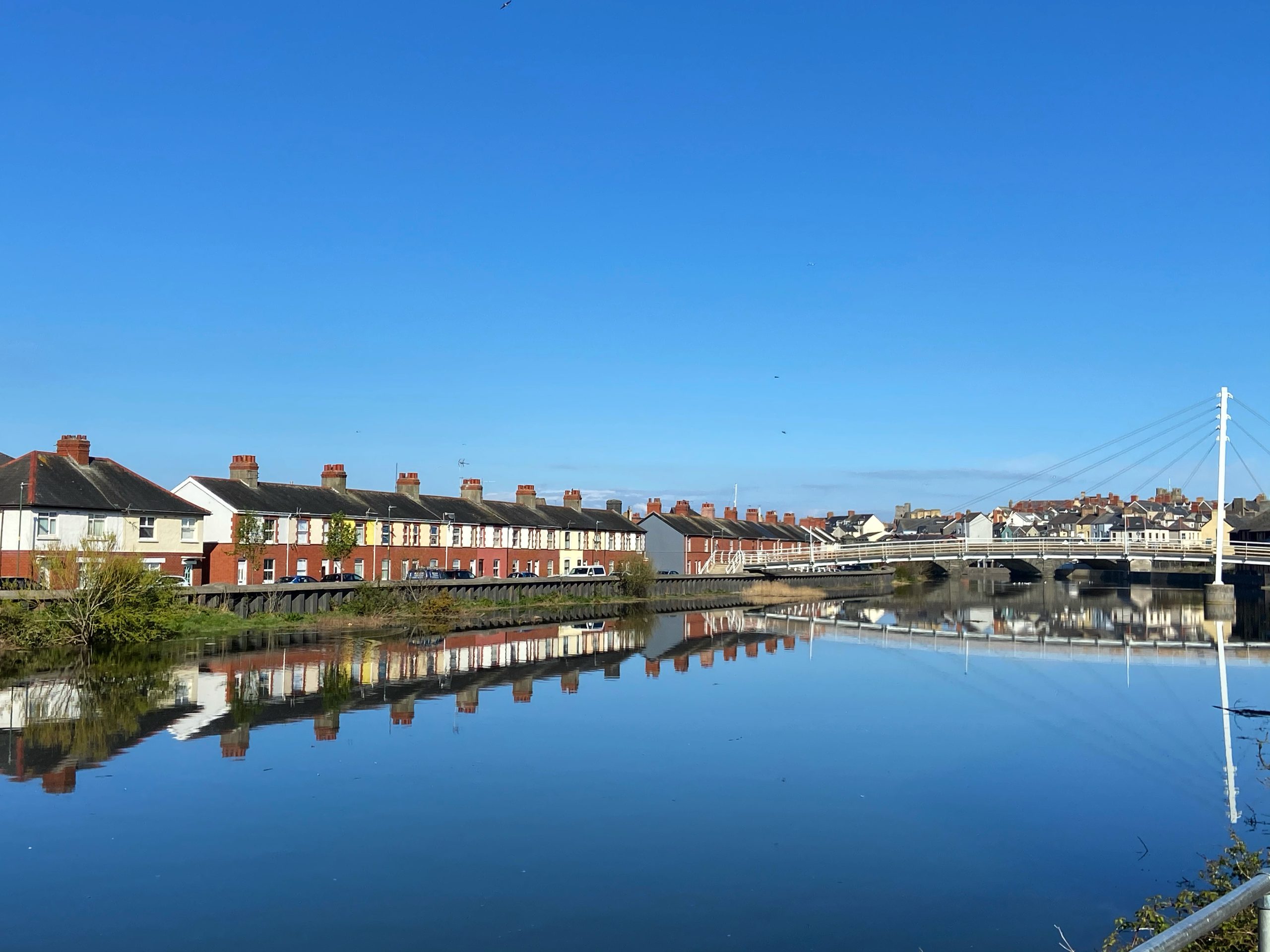 A row of terraced house on Afon Rheidol river at Aberystwyth on a sunny day
